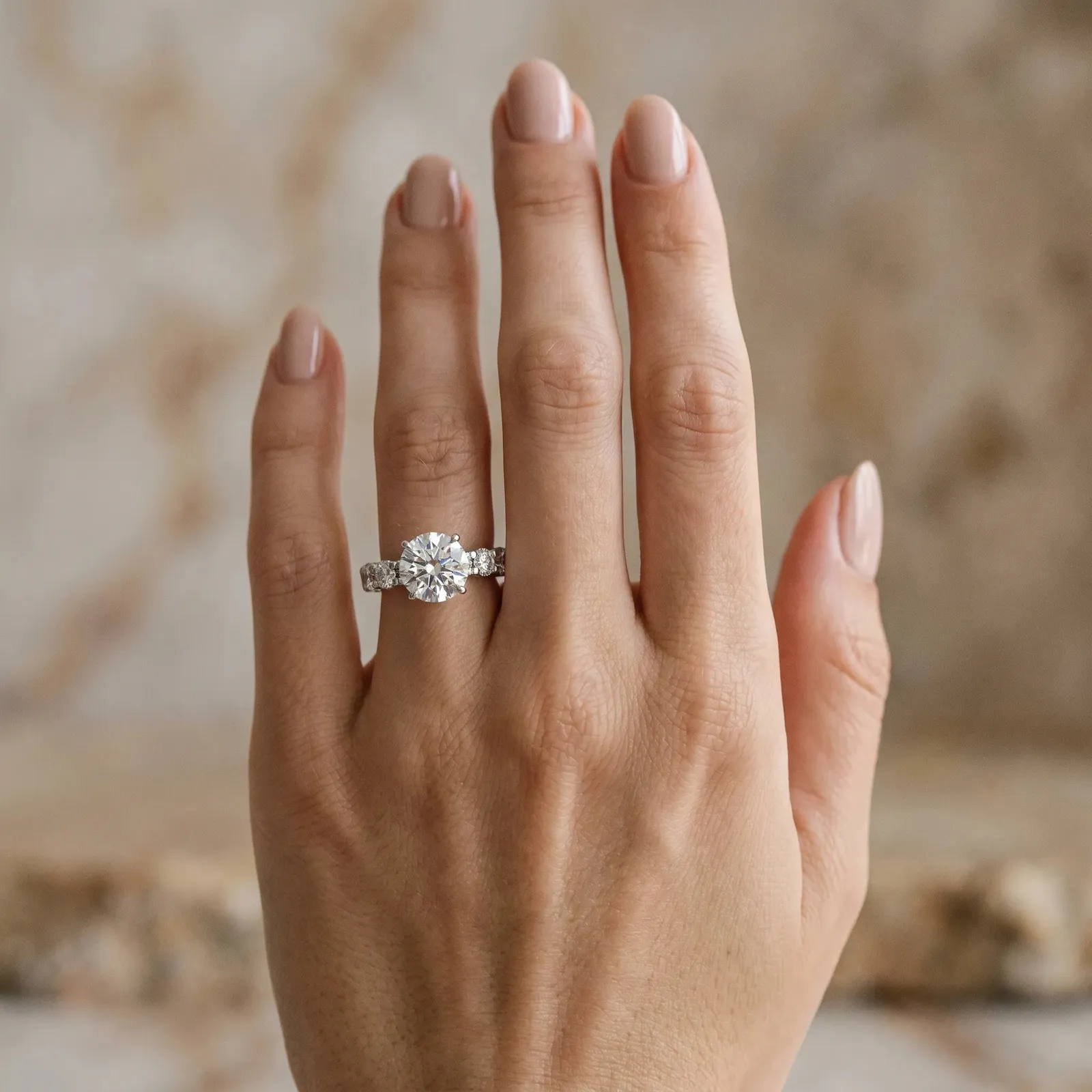 Round Cut Diamond Side Stone Engagement Ring with Four-Prong Setting Silver