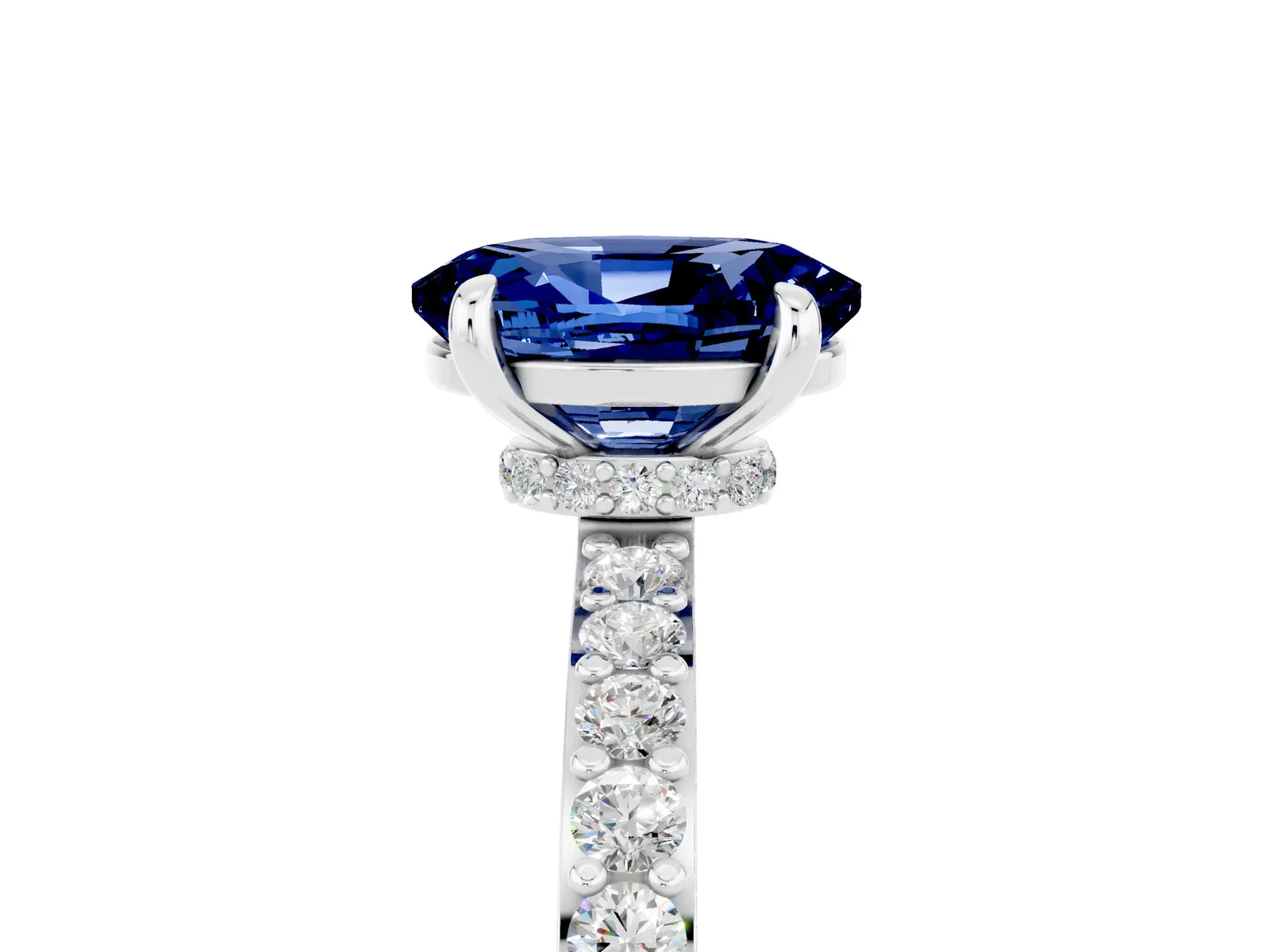 Oval Cut Blue Sapphire Solitaire Engagement Ring with Pavé Band and Four-Prong Setting Platinum